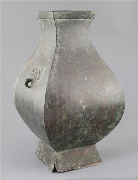 A Chinese archaic bronze wine vessel, Fanghu, Han dynasty, 3rd century B.C-3rd century A.D. , 34cm high, section of foot lacking